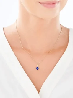 Złota zawieszka z lapisem