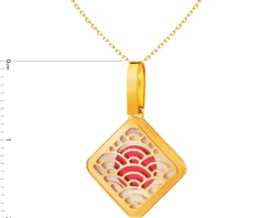 Złota zawieszka z masą perłową i emalią