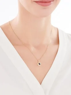 Złota zawieszka z szafirem syntetycznym i cyrkoniami