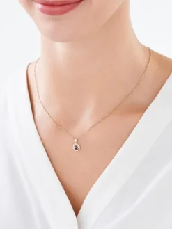 Złota zawieszka z szafirem syntetycznym i cyrkoniami