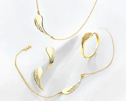 Złoty pierścionek z cyrkoniami - skrzydło